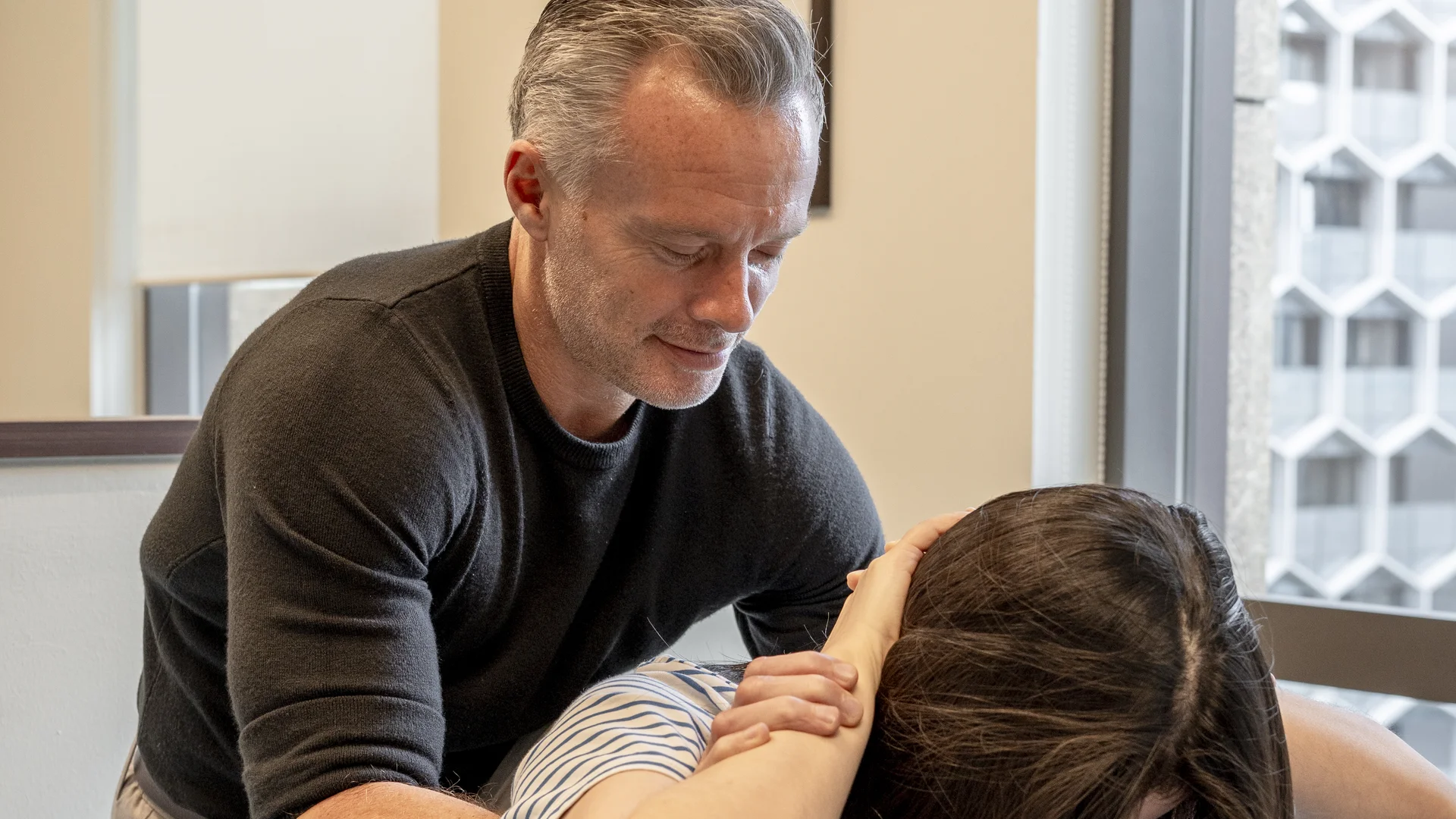 Chiropractic care being delivered to a patient at Elite Spine Centres.